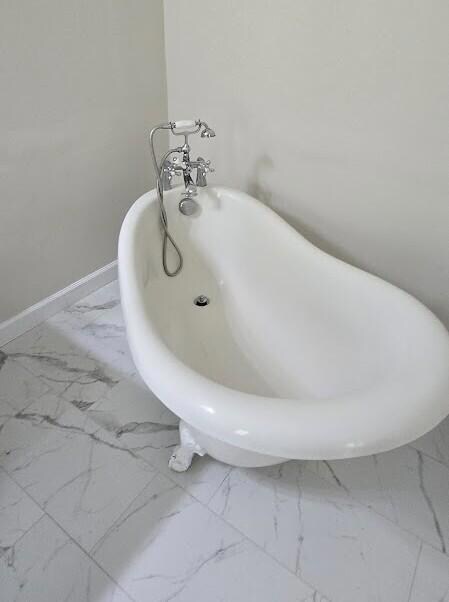 claw foot tub tile floors