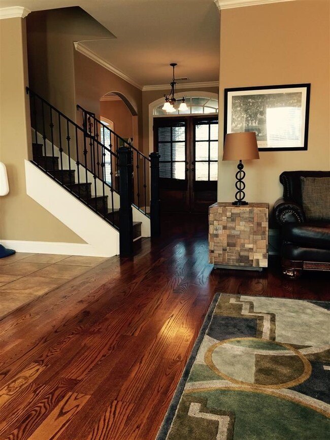 The home has a large dining room, featuring arched