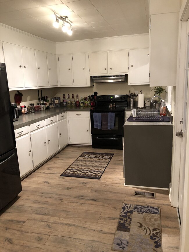 Kitchen has ample cabinets for storage! Beautiful flooring and updated light fixtures! 941 Oak St, Lewisburg, TN 37091