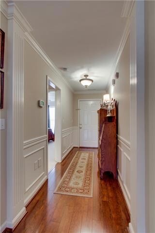 From the moment you step into the lovely foyer, greeted by stunning hardwoods and  wainscoting trim, the open floor plan welcomes you home. 