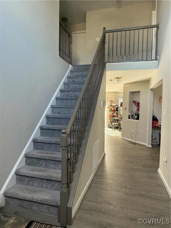 Staircase with wood-type flooring