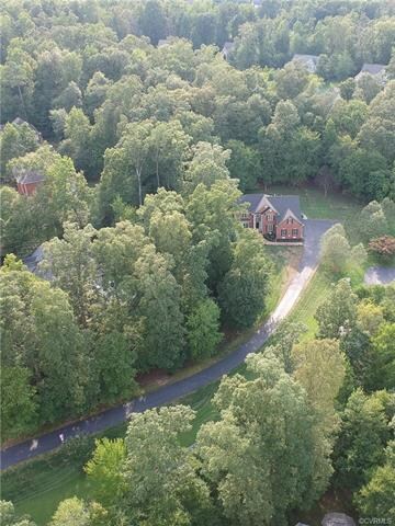 The house is tucked away behind a private driveway