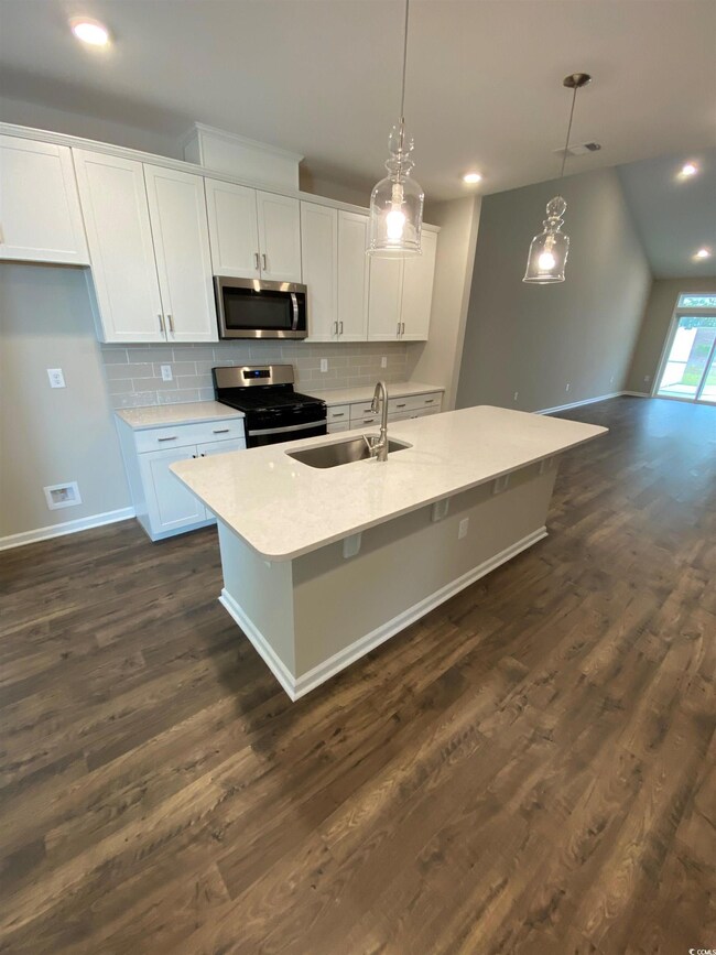 Kitchen featuring appliances with stainless steel 