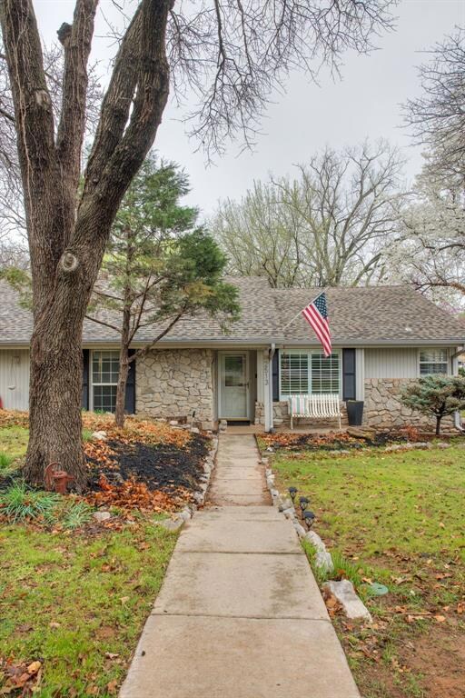 Ranch-style home with a front yard