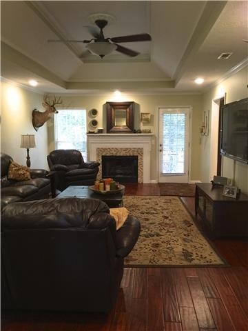 Great Room w/fireplace opens to kitchen & deck.