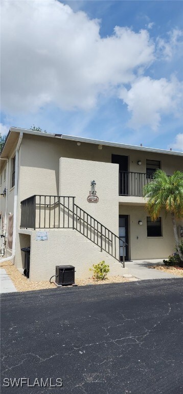 View of property with cooling unit