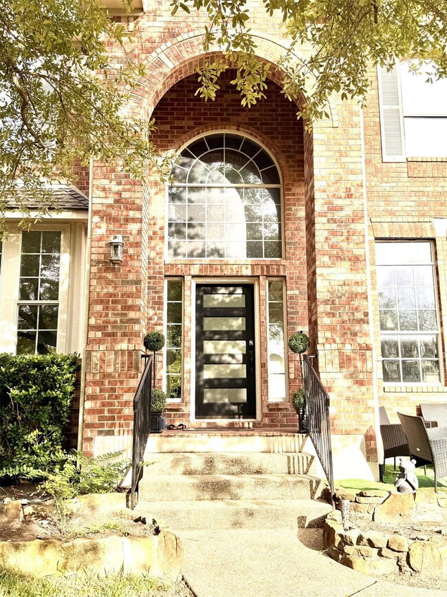 Property entrance with brick siding