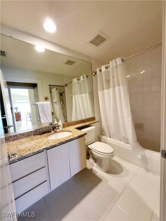Full bath with visible vents, toilet, vanity, show
