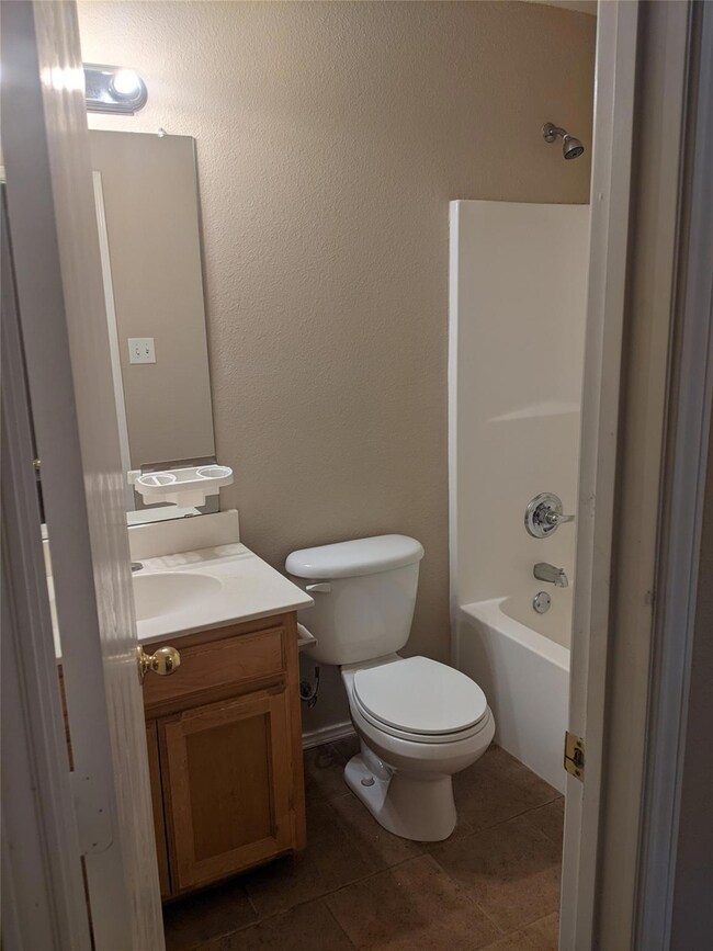 Full bathroom featuring  shower combination, tile 
