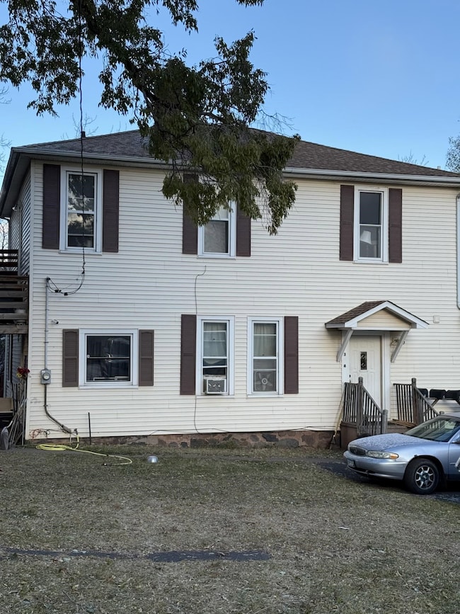 View of front of house with a shingled roof