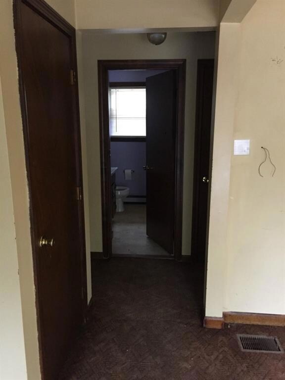 Hallway leading to the bathroom and...