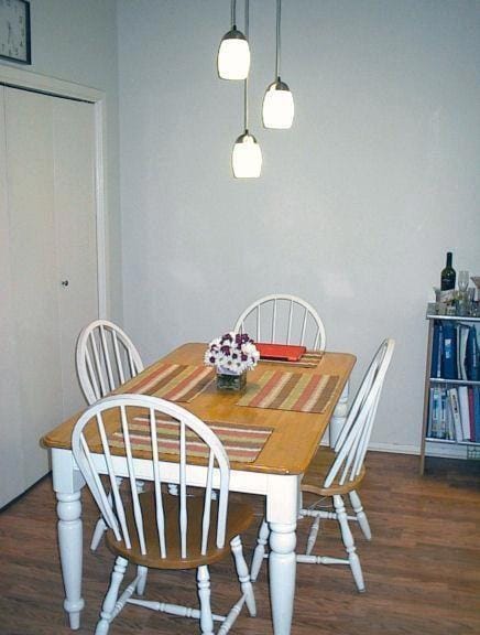 Dining space featuring dark wood finished floors