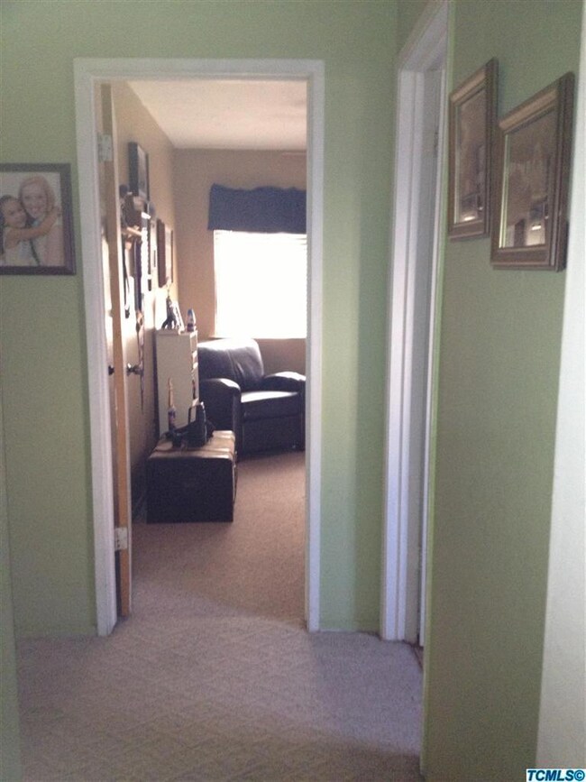 Hall looking into 2nd bedroom being used