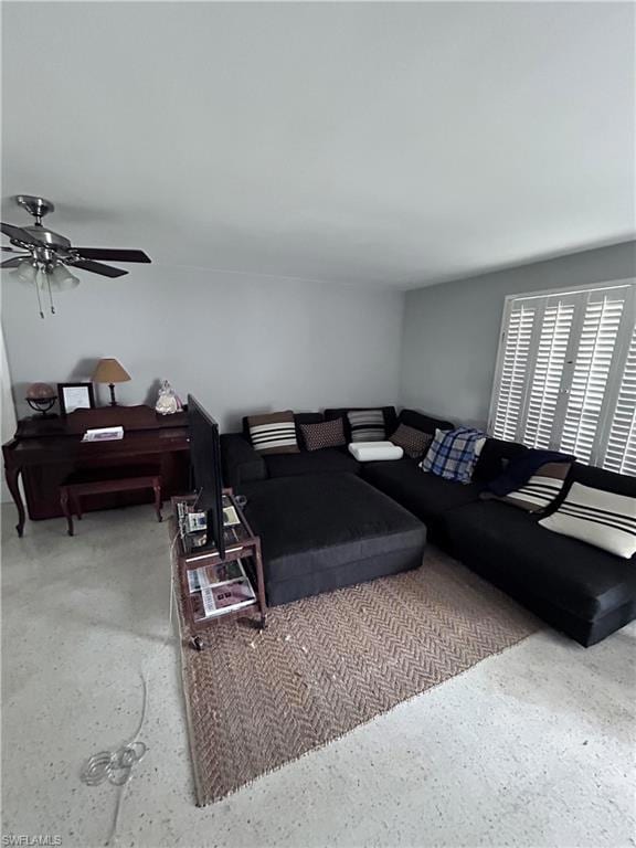 Living room featuring ceiling fan