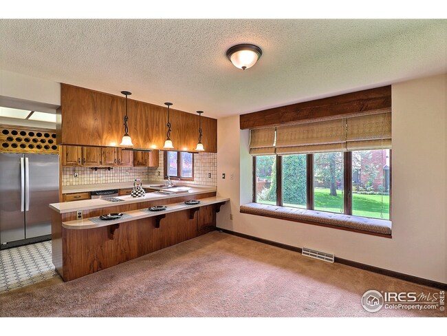 Dining Room Plus a Long Breakfast Bar for Extra Seating