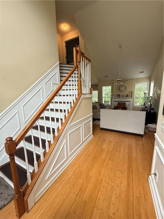 Stairs with a decorative wall, wood finished floor