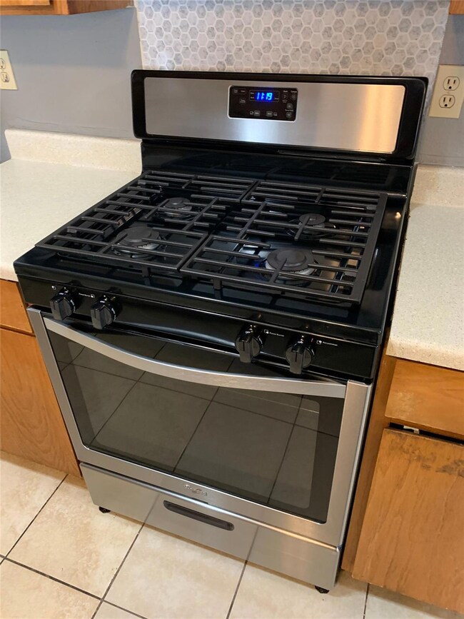 Room details with decorative backsplash, brown ca
