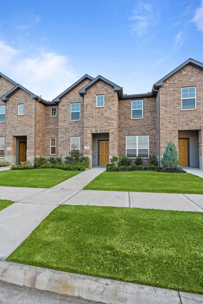 As you step closer, the front porch beckons, offering a cozy spot to relax with a morning coffee or wave to neighbors as they stroll by.
