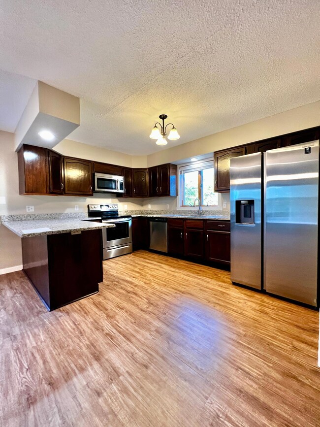 Gorgeous kitchen with stainless steel appliances and granite countertops