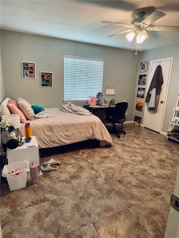 Bedroom featuring a ceiling fan