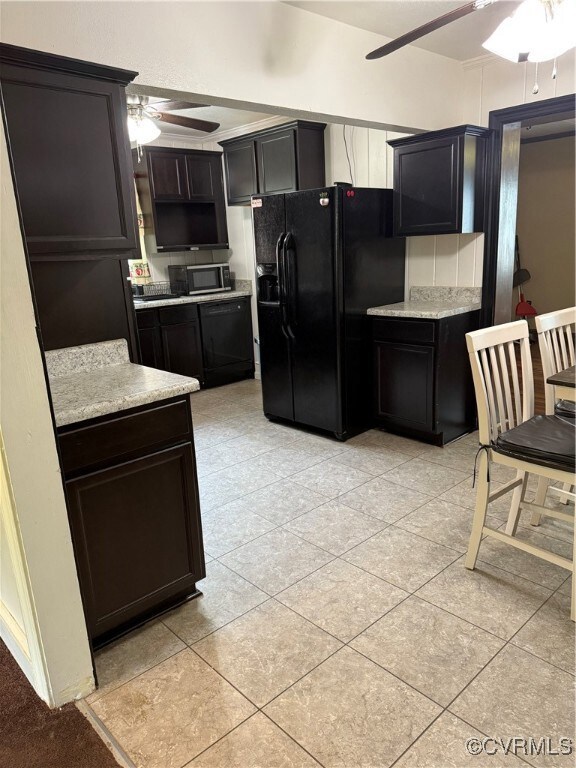 Kitchen with light tile patterned floors, refriger