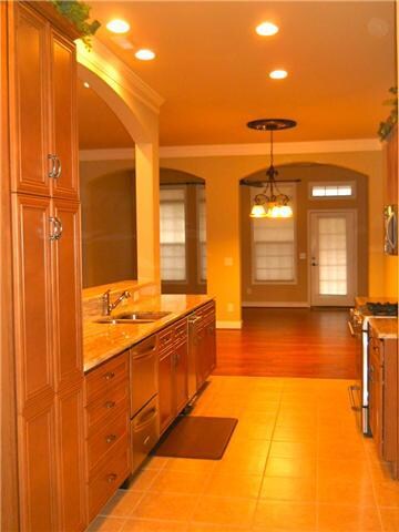The kitchen has granite countertops, cabinets galore & a gas stove.