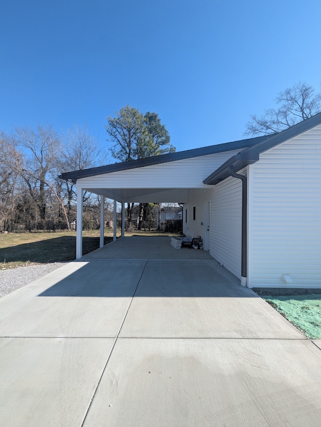 Covered carport that leads into the back door
