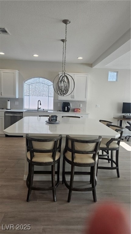 Dining area with recessed lighting, dark wood-styl