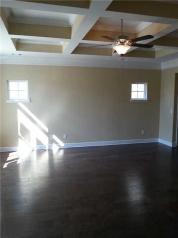 The Great Room is all hard wood with an impressive ceiling.