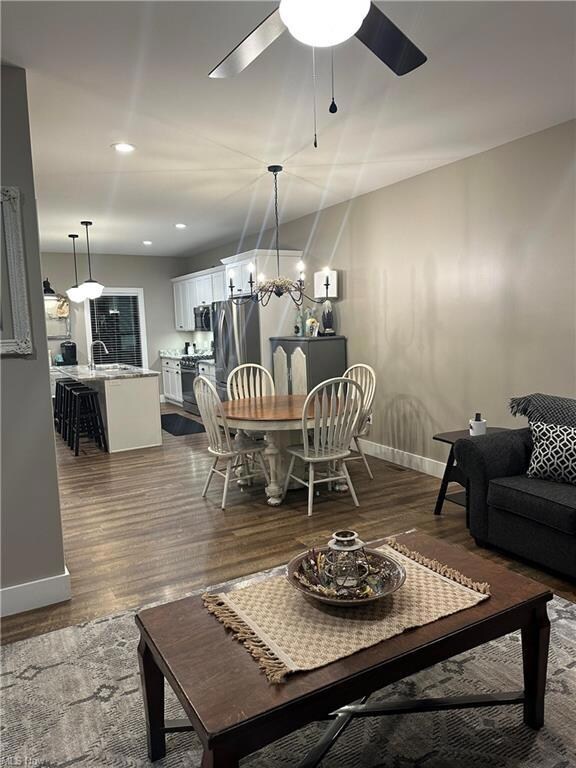 Living room with wood-type flooring and ceiling fa