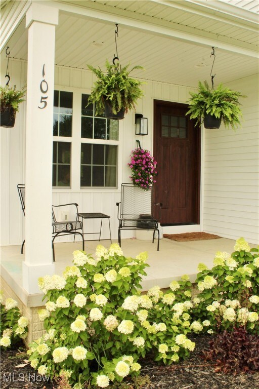 Property entrance featuring covered porch