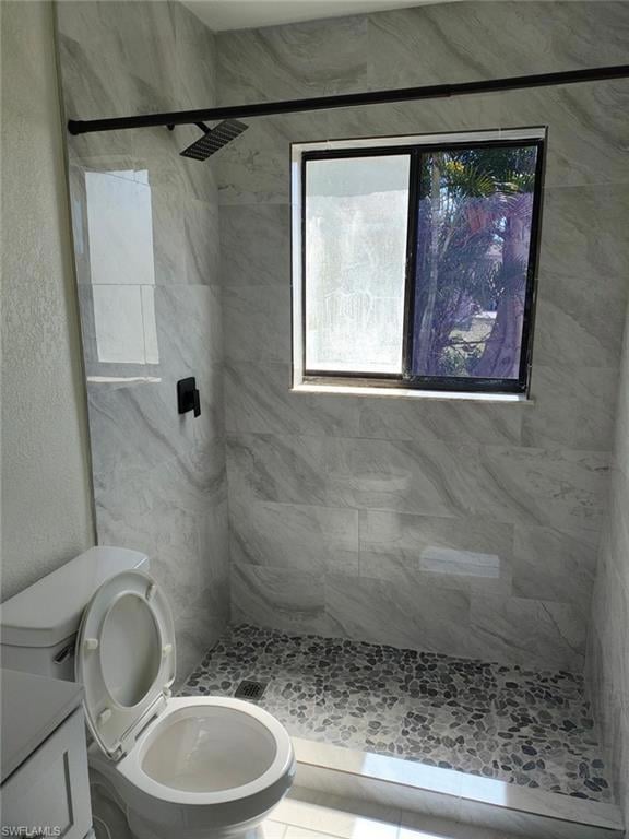 Bathroom featuring a shower stall and vanity