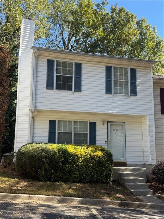 View of front of property with a chimney