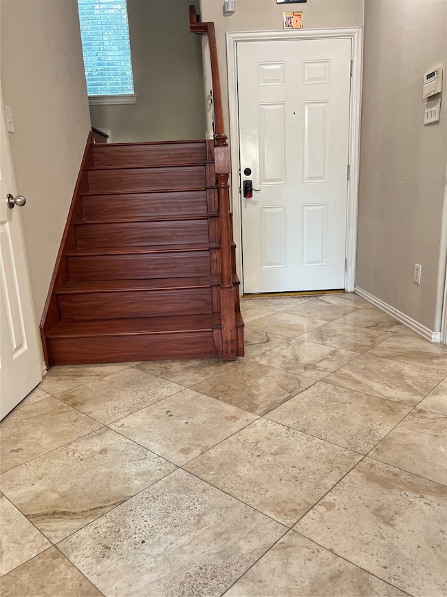 Staircase leading to upstairs Master and 2 other bedrooms