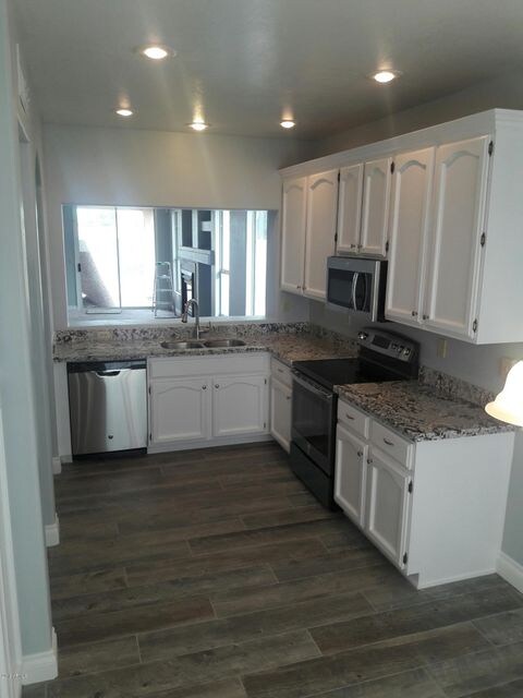 New granite counter tops and tile floor