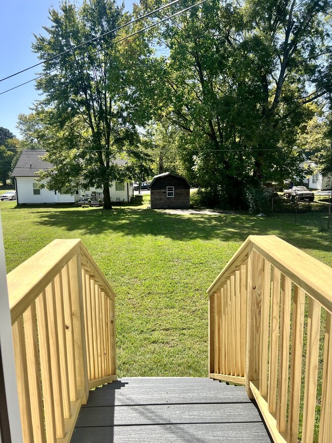 The stairs leading from the back door into the backyard.