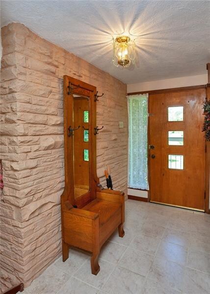 The mid-century feel of this home greets you at th