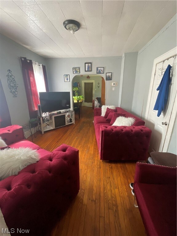 Living room featuring dark hardwood / wood-style flooring