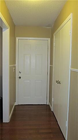 Foyer has hardwood flooring and a large coat closet.