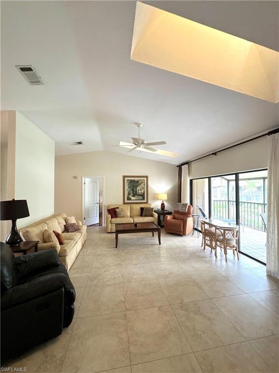 Spacious living area with a large, enclosed lanai area and gorgeous view of the resort style pool and lush landscaping.