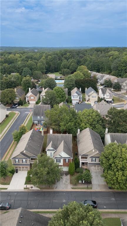 Aerial view of residential area with a forest