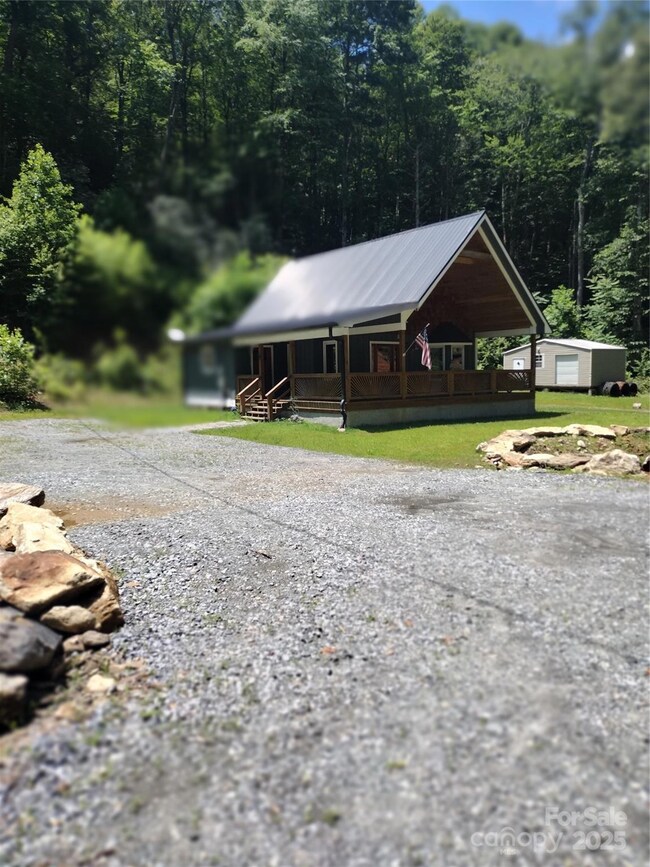 View of home and storage building