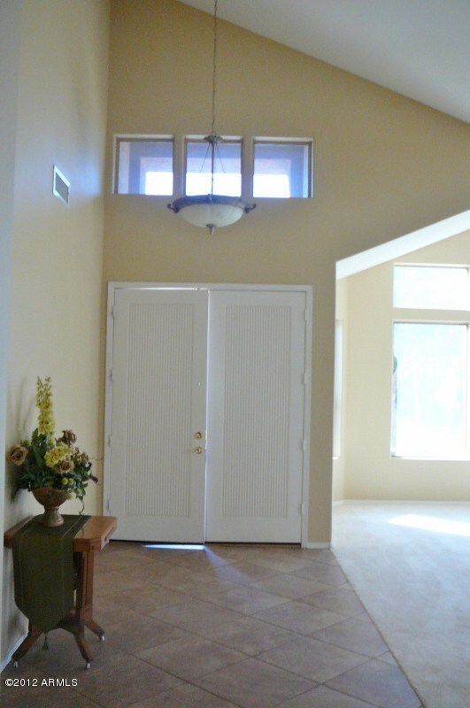 Double door entry into tiled entry
