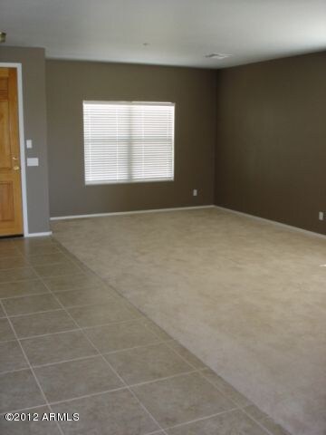 LIVING ROOM - TRAFFIC AREAS ARE TILED