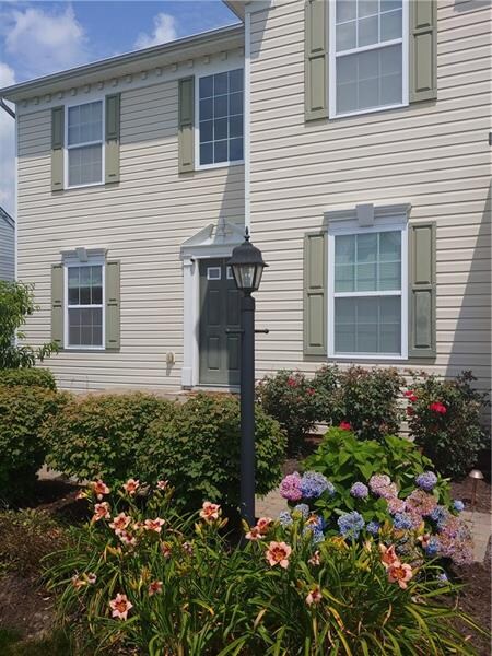 Inviting landscaping welcome you home.