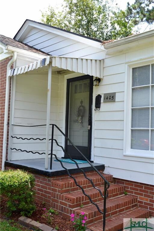 Covered front porch with storm door