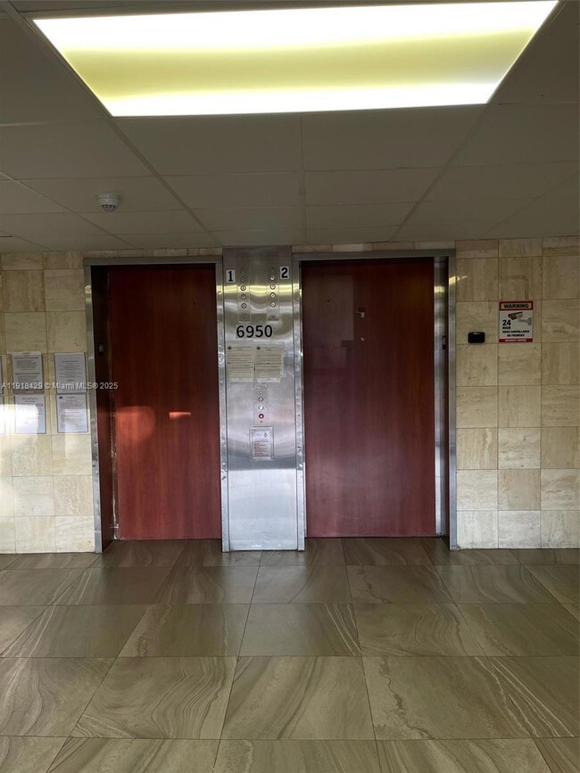 6950 Miami Gardens Dr unit 2-312A, Hialeah, FL 33015 - photo 2