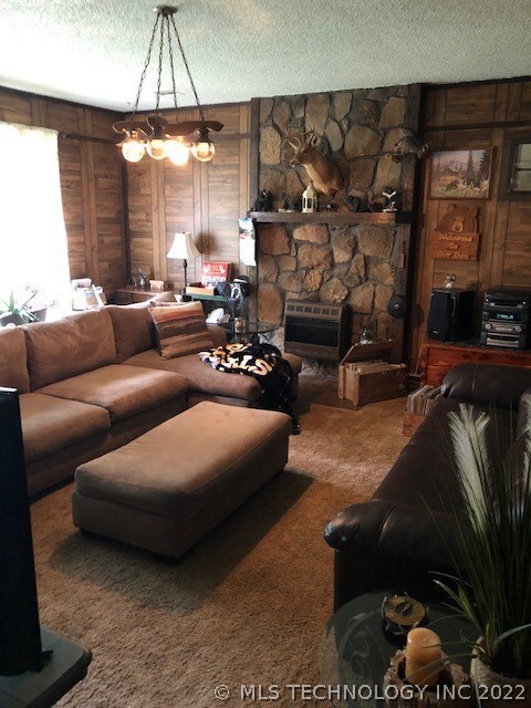 Large sunken living  room with huge windows, and l