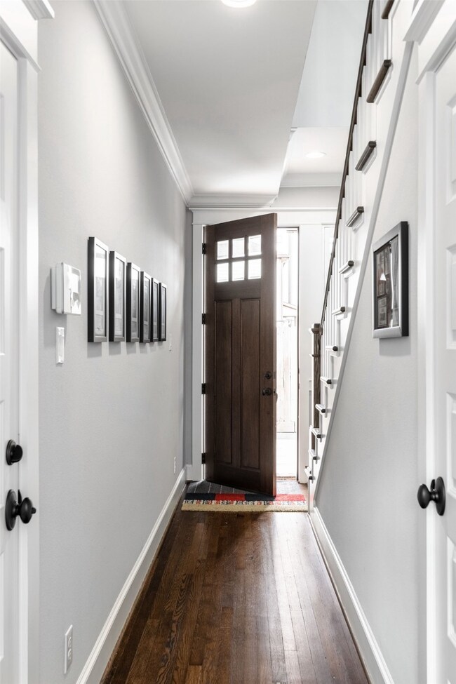 An airy and bright foyer welcomes you inside this