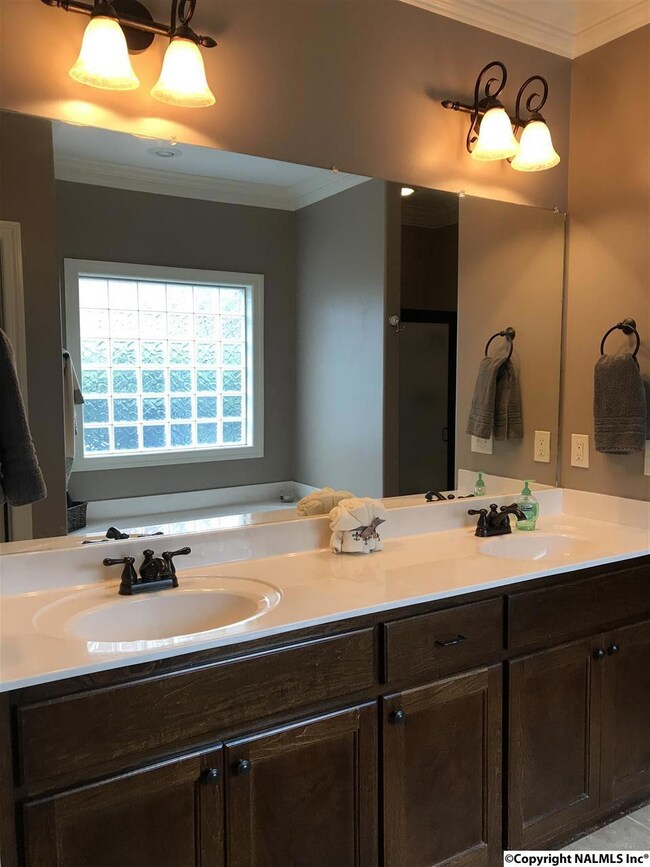 Master bathroom with water closet, laundry closet, jetted tub and separate shower.